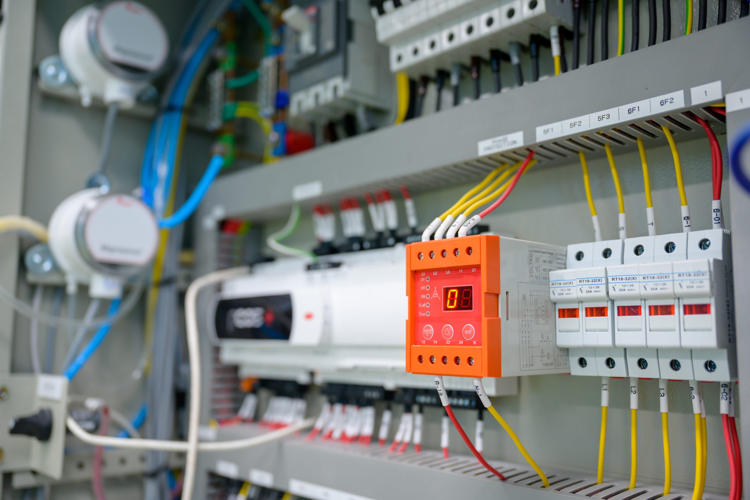 Close-up shot of an industrial electric automatic electrical control box that supplies the power line in an electrical control cabinet. electric background selective focus