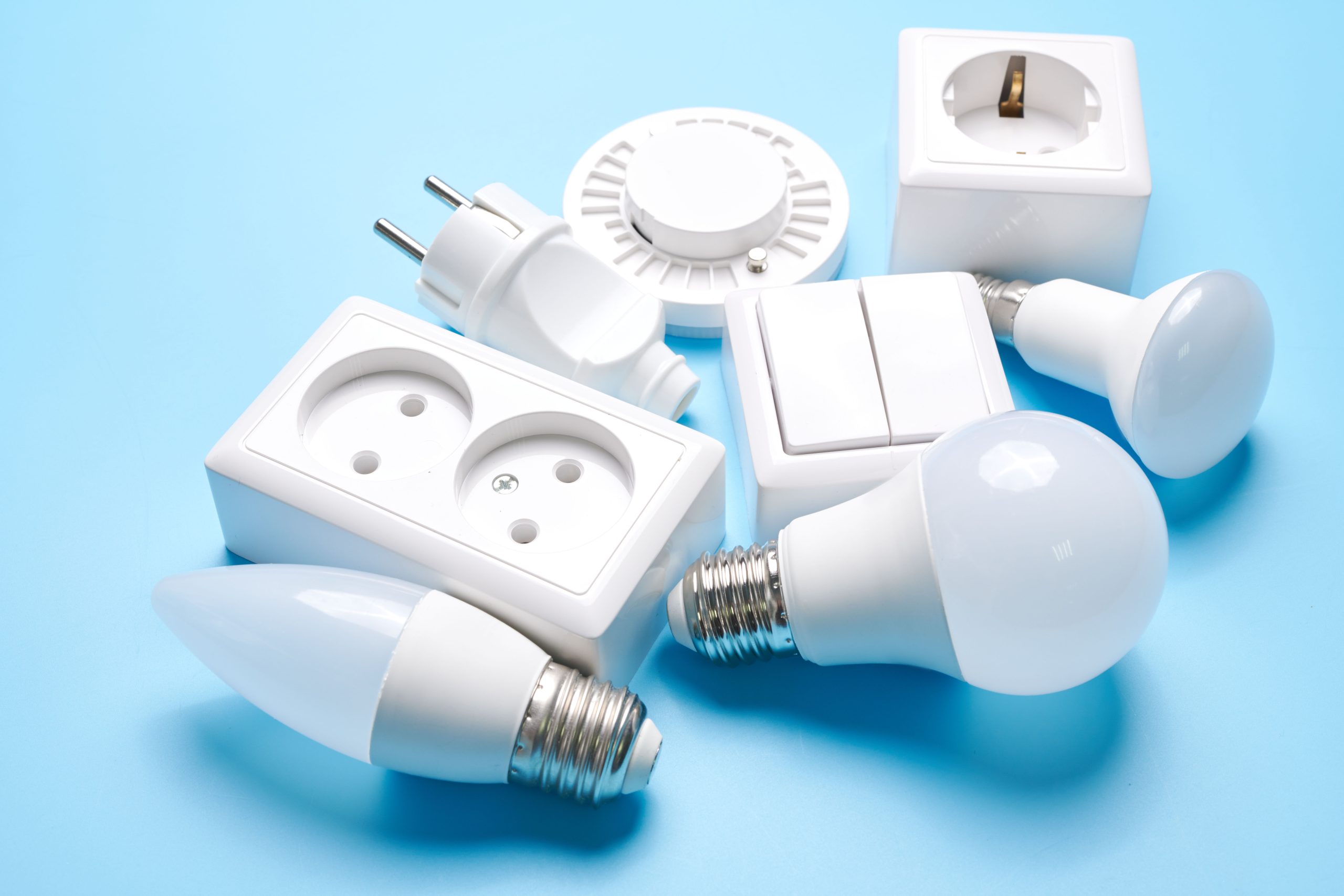 Electric light set with dimmer switch, controllable lighting. Saving energy concept, device designed to change electrical power isolated on blue background