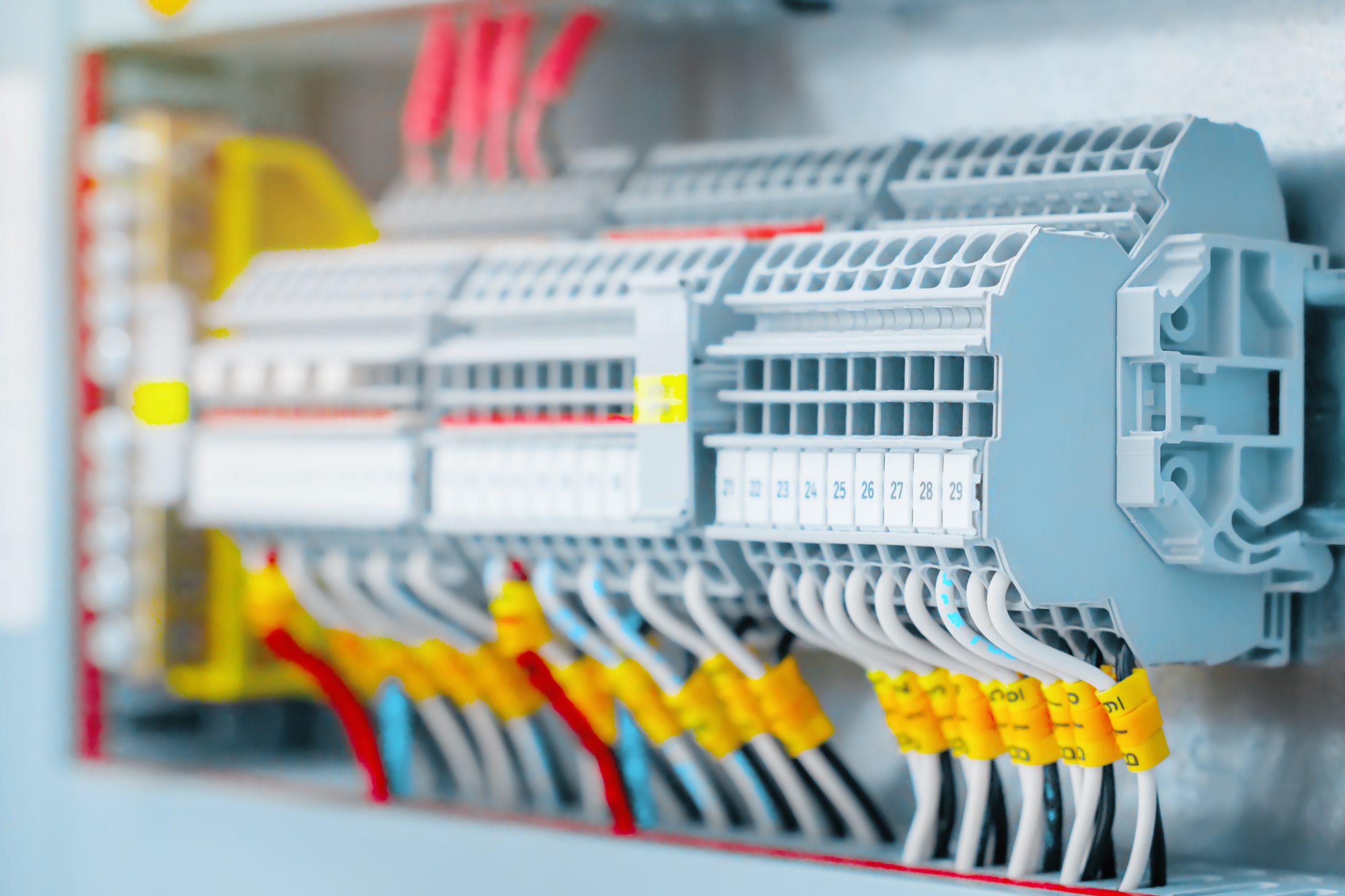 New wiring and automatic machines in the electrical panel. Live wires close up. Background for electrical services